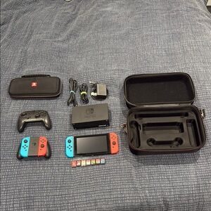 Nintendo Switch with pro controller, 2 extra joycons, dock and 2 cases and7games